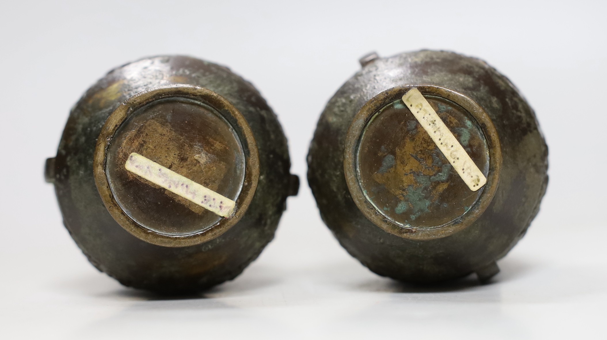 A pair of Chinese two handled bronze bottle vases, late Ming dynasty, 17cm